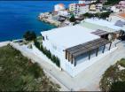 The two-storey townhouse 220 m2 with big pool 25 m from sea