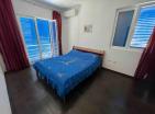 Sea-side mountain-view apartment 50 m2 in Baošići, best deal!